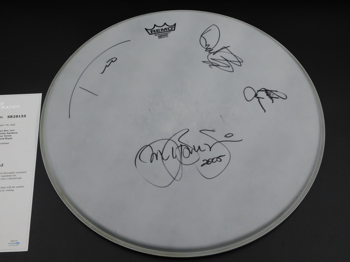 Bon Jovi Band Signed 2005 Tour Used Drum Head Jon Bon Jovi, Richie Sambora, Tico Torres and David Bryan ACOA LOA